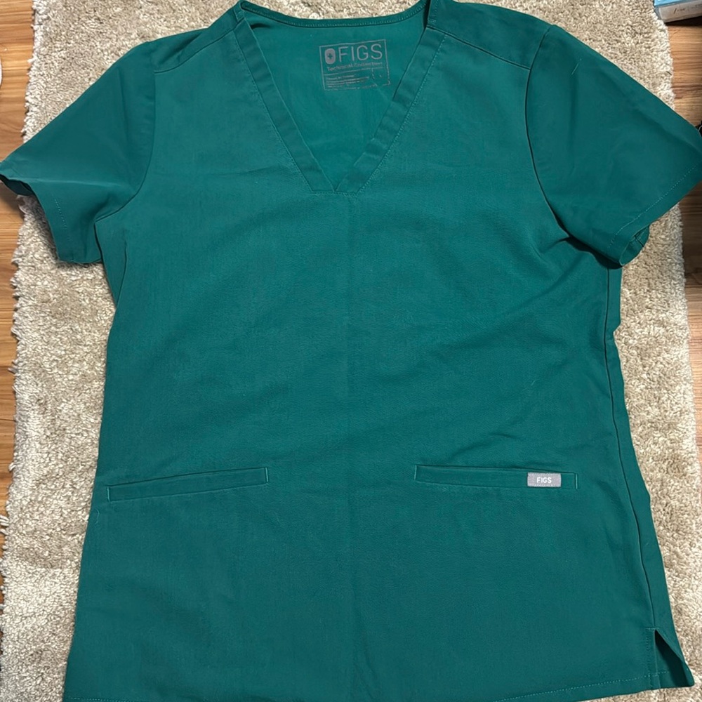 Figs green two pocket scrub top. Good used condition. Size small